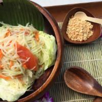 Papaya Salad · Spicy. Grated Fresh Green Papaya Tossed with Sugar Sweet Tomatoes in Spicy Garlic Lime Sauce...