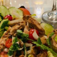 Thai Grilled Chicken Salad · Spicy. Grilled Chicken slices Tossed with Lettuce, Tomatoes, Cucumbers & Onions in Chili Gar...