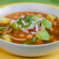 Pozole Soup · Braised chicken, hominy, onions, cilantro, and radishes in a guajillo chili broth.