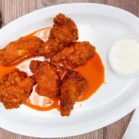 Buffalo Wings · With bleu cheese or bbq sauce.