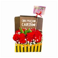 Con Todo Mi Amor · Box with red roses.
