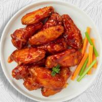 Bluffing Buffalo Wings · Fresh chicken wings breaded, fried until golden brown, and tossed in buffalo sauce.