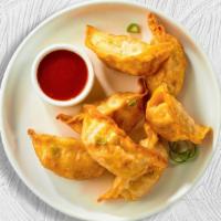 Famous Shrimp Dumplings · Minced shrimp and veggie dumplings deep fried until golden brown.