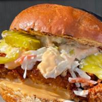 Nashville Chicken Sandwich · Fried Chicken breast dipped in hot oil, powdered to your liking of spice level. Served on a ...