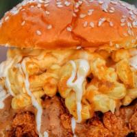 Mac N' Chickys · Fried Chicken Breast topped off with mac and cheese. Served on a brioche bun.