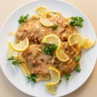 Chicken Francese · Chicken breast fried in a light batter, topped with a creamy lemon sauce.