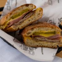 Cuban · Flavorful roast pork, premium sliced ham, swiss cheese slices and tangy pickles, horseradish...