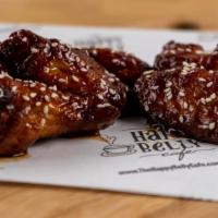Chicken Wings · Crispy fried chicken wings served with your choice of sauce.
