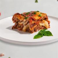 Classic Lasagna · Layers of gluten-free pasta, ricotta, mozzarella, ground beef, and tomato sauce baked in an ...