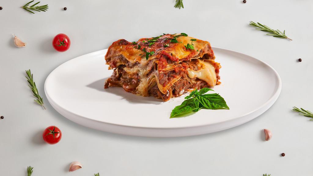 Classic Lasagna · Layers of gluten-free pasta, ricotta, mozzarella, ground beef, and tomato sauce baked in an oven and topped with parmesan.