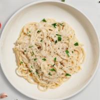 Classic Carbonara · Classic Italian pasta dish made with eggs, Parmigiano-Reggiano cheese, pancetta, and black p...