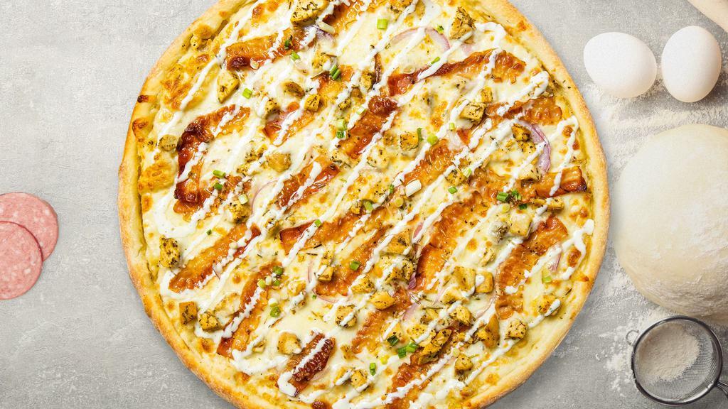 Sinful Alfredo Pizza · Alfredo sauce and bits of bacon hand-tossed gluten free dough.
