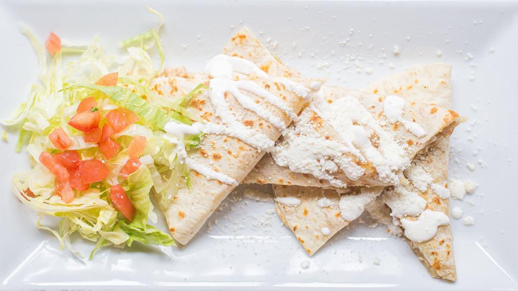 Vegetables Flour Quesadilla · Mozzarella cheese topped with sour cream and cheese. Vegetarian.