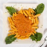 Penne Vodka · Tomato creamy vodka sauce with minced proscuitto