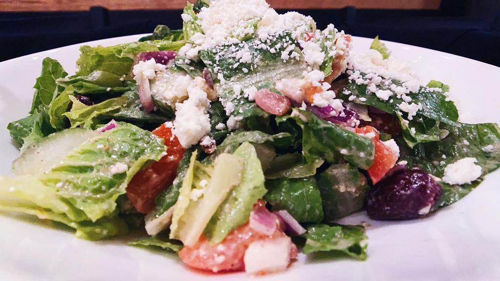 Greek Salad · Gluten-free. Romaine, plum tomatoes, Kalamata olives, cucumbers, red onions and feta cheese with traditional Greek dressing.
