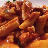 Penne Ala Vodka · Represents a classic enjoyed by many for over 18 years. Served with pancetta, onions and tom...