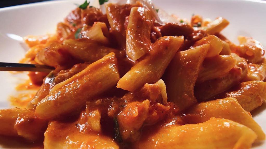 Penne Ala Vodka · Represents a classic enjoyed by many for over 18 years. Served with pancetta, onions and tomato cream sauce.