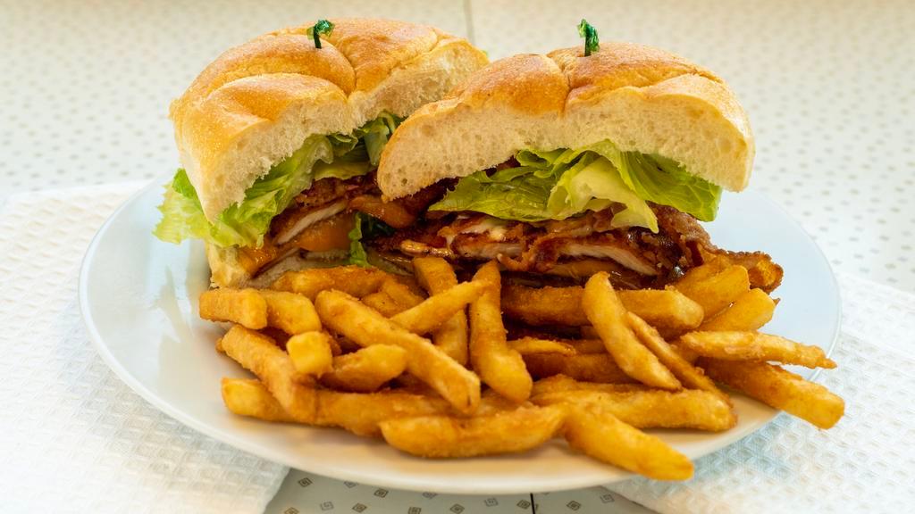Norwalker Sandwich · Voted Town Favorite!! Chicken cutlet, lettuce, bacon, cheddar, hot sauce and ranch. Served on your choice of bread.