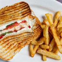 Caprese Panini · Mozzarella, roasted peppers, tomato and basil. Served on andy's home-made bread. Fresh, tusc...