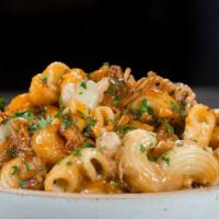 Monster Mac & Cheese · Our homemade four-cheese Monster Mac, baked with love and tenderness.  Top with chicken, bac...