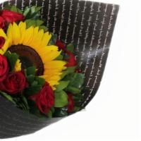 Red Roses And Sunflower  · Dozen roses
1 sunflower 
Roscus Israeli (green leaves)