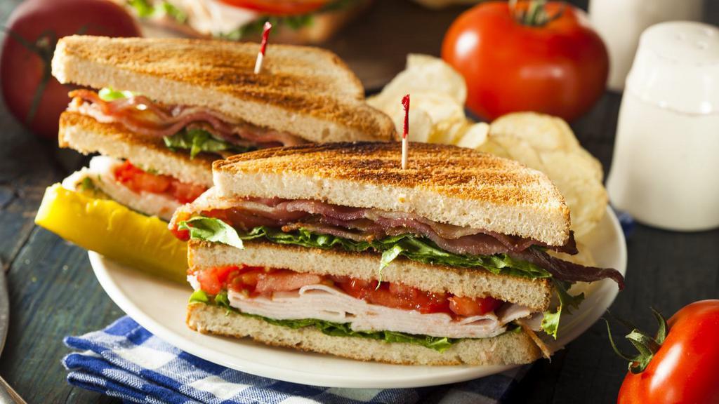 Turkey Club Sandwich · Delicious Sandwich made with Turkey, Turkey Bacon, Lettuce, Tomatoes, Mayo.