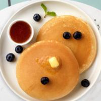 Blueberry Pancakes · Fluffy pancakes cooked with care and love served with blueberries, butter and maple syrup. S...