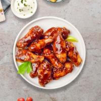 Smokin' Bbq Chicken Wings · Fresh chicken wings breaded, fried until golden brown, and tossed in barbecue sauce. Served ...