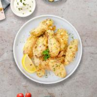 Garlickin' Good Parmesan Wings · Fresh chicken wings breaded, fried until golden brown, and tossed in garlic and parmesan. Se...