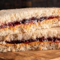 Peanut Butter & Jelly Sandwich · All natural creamy peanut butter and organic strawberry jam on a pretzel croissant or your c...