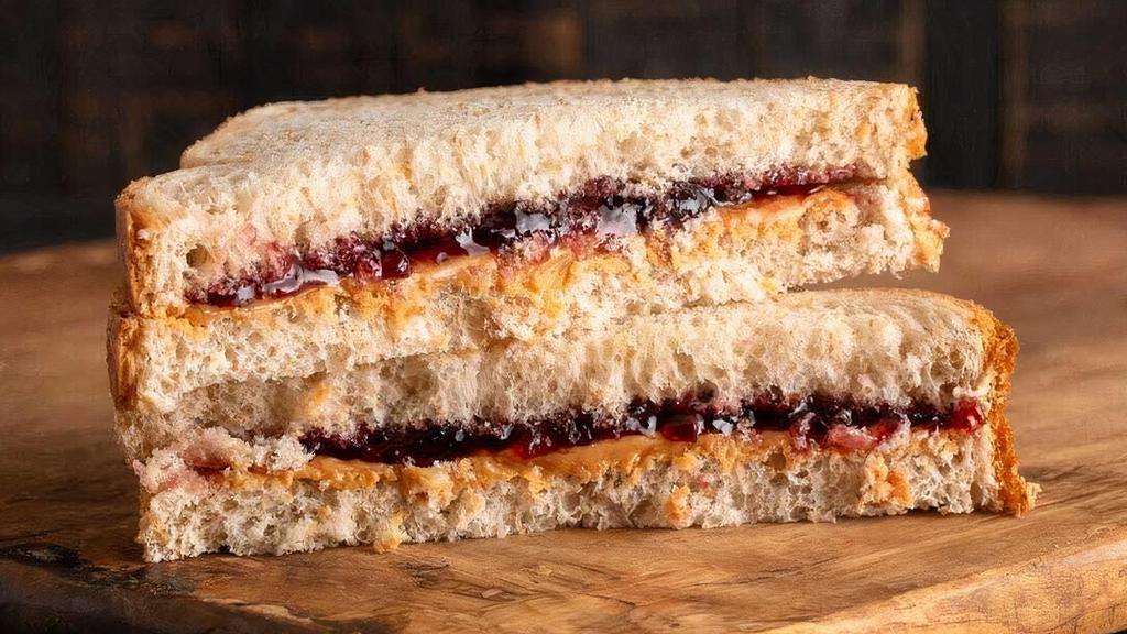 Peanut Butter & Jelly Sandwich · All natural creamy peanut butter and organic strawberry jam on a pretzel croissant or your choice of bread.