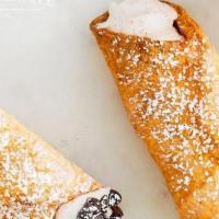Mini Cannoli · A crispy pastry shell filled with a sweet, creamy ricotta and chocolate chip mixture.