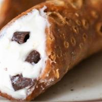 Cannoli · A crispy pastry shell filled with a sweet, creamy ricotta and chocolate chip mixture —a stap...