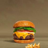 Cheeser Pleaser Burger  · American beef patty topped with melted cheese, lettuce, tomato, onion, and pickles.