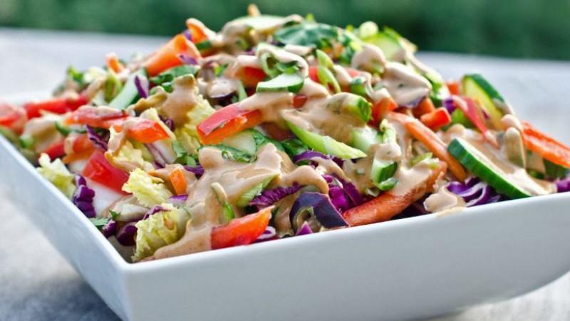 Thai Crunch · cabbage, romaine, edamame, peppers, onions, wonton crisps, peanut dressing (Vegan/Vegetarian)