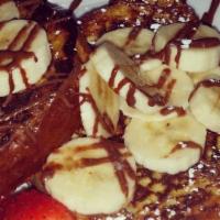Super Waffles · Strawberry, banana, walnuts, Nutella, whipped cream and two scoops of ice cream of your choi...