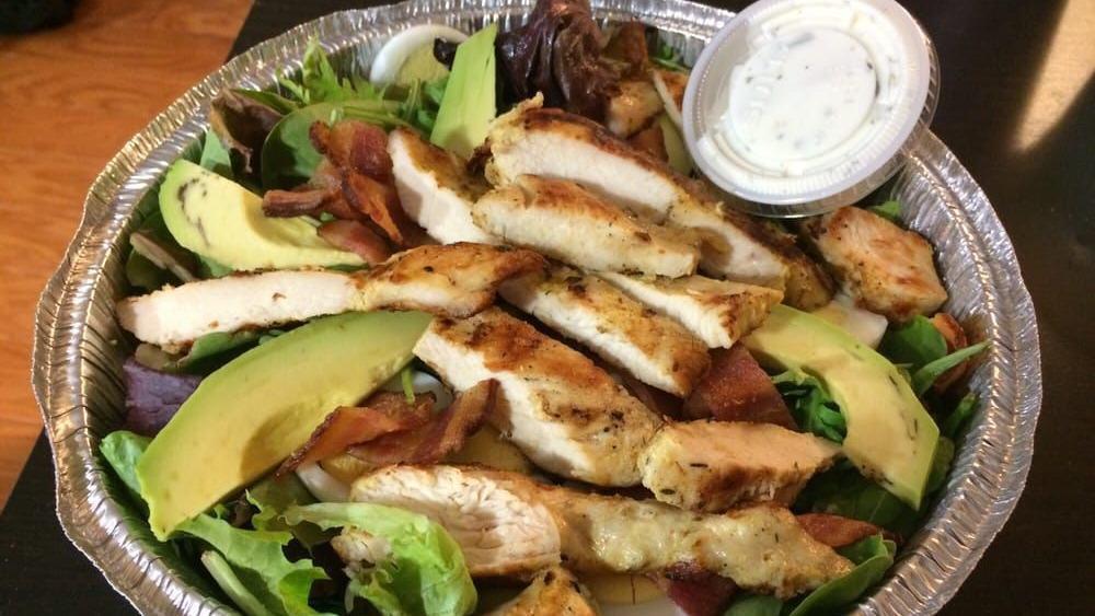 Chicken Cobb Salad · Chicken, mixed greens, avocado, crispy bacon, blue cheese and a hard-boiled egg. Tossed in our special creamy tarragon dressing.
