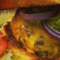 9 Oz Cheeseburger · Your choice of cheese. 100% Angus beef served on a toasted brioche bun. Includes lettuce, to...
