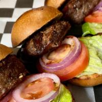 Beef Sliders · Three pieces burger sliders served with lettuce, tomato, pickles.