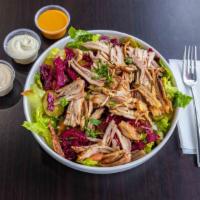 Shawarma Salad · Baby chicken shawarma seasoning, served on bed of lettuce with your choice of topping and dr...