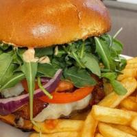 The 'Boken Burger · 8 oz Angus All-Beef Burger topped with Swiss cheese, crispy bacon, arugula, housemade spicy ...