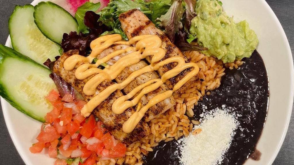 Grilled Mahi Mahi Salad · Comes with Organic Greens, Honey Lime Dressing, Mexican Red Rice, Black Beans, Guacamole, Pico de Gallo, Chipotle Aoili and cotija cheese