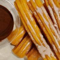 Churros · Mexican style donuts with cinnamon and sugar served with chocolate sauce