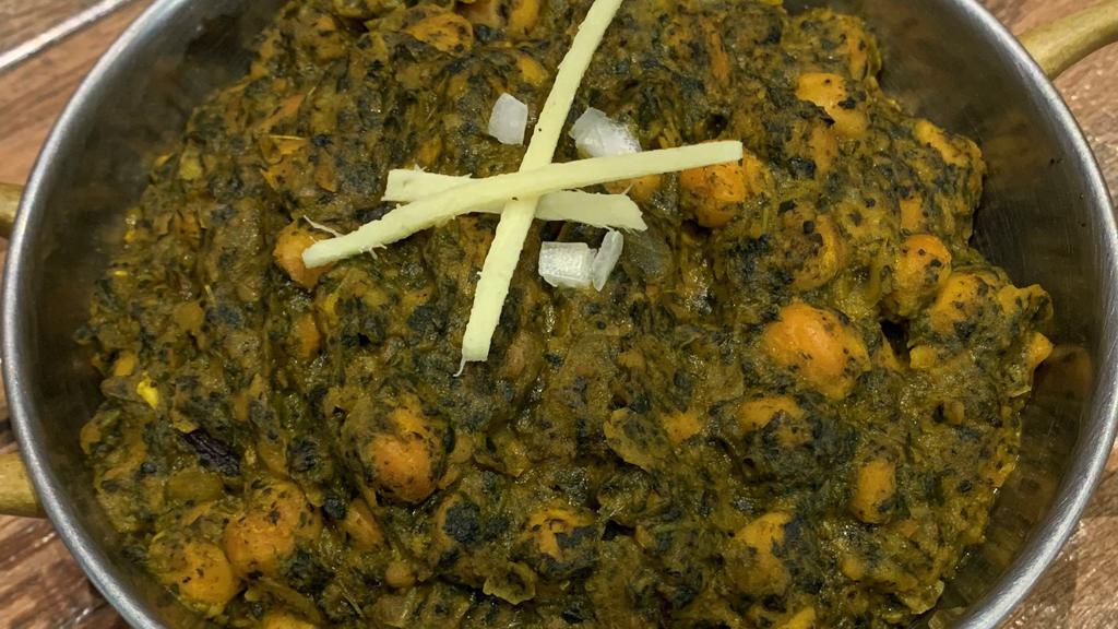 Chana Saag · Vegan, Gluten-Free. Chickpeas cooked with fresh spinach, onions, ginger, garlic & spices.