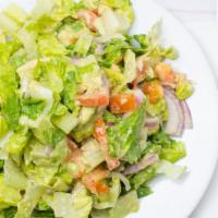 Avocado Salad · Crisp romaine, avocado, red onion, tomatoes, EVOO and lemon.
