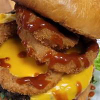 Onion Ring Burger  · Premium short rib burger topped with American cheese, onion rings, pickle, lettuce, tomato, ...