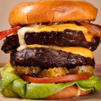 Double 16 Oz Cheeseburger · 2 Premium short rib burger patties topped with Triple American cheese, grilled onions, lettu...