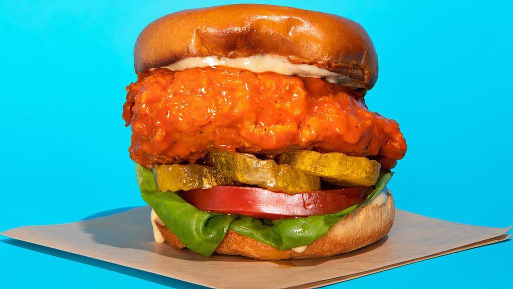 Buffalo Chicken Sandwich  · Fried chicken sandwich tossed in our signature homemade buffalo sauce served with lettuce, tomato, b&b pickles, and our house sauce on a buttered toasted brioche bun.