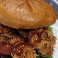 Shrimp Rich’ Boy Sandwich · Seasoned fried shrimp served on a toasted brioche bun, with our house sauce, lettuce, tomato...