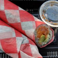 Spicy Tuna Burrito · Inside with lettuce cucumbers avocado and carrots.
